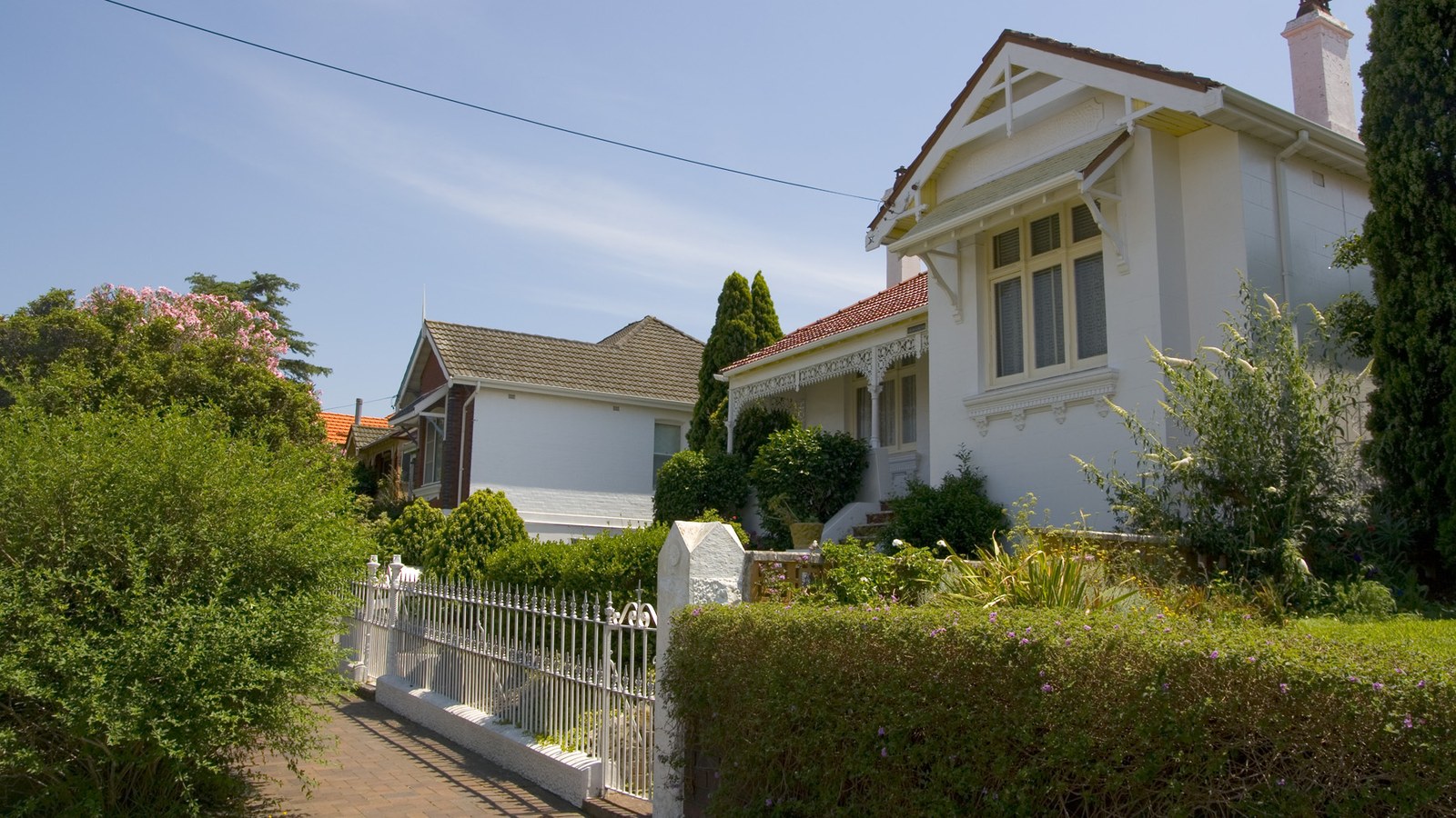 Suburban house behind a picket fence in Dulwich Hill