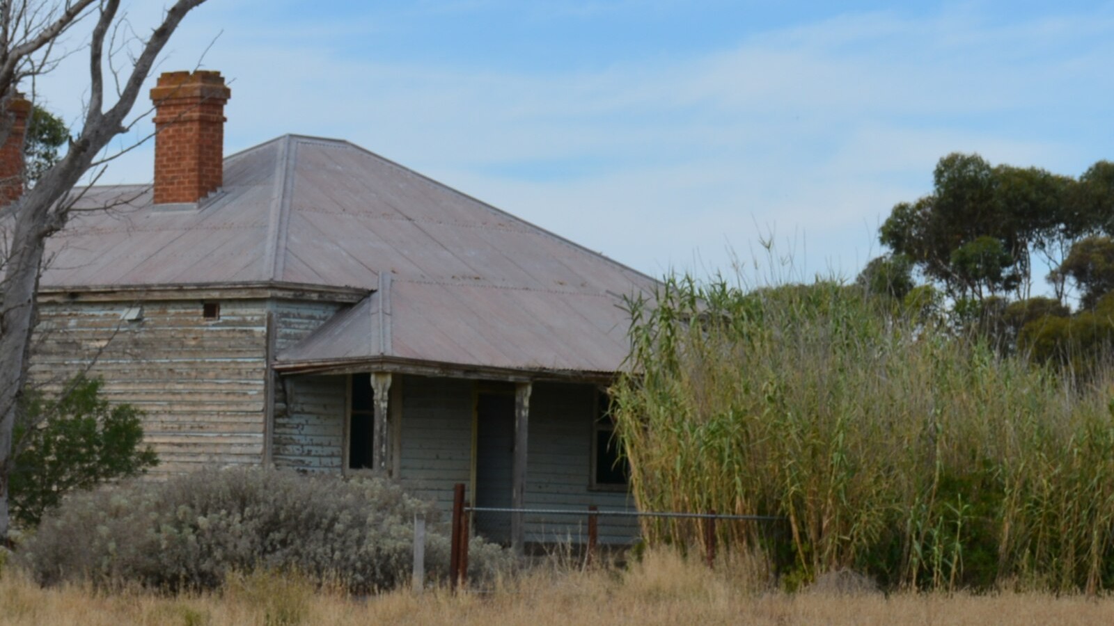 Old weatherboard cottage on a large country block